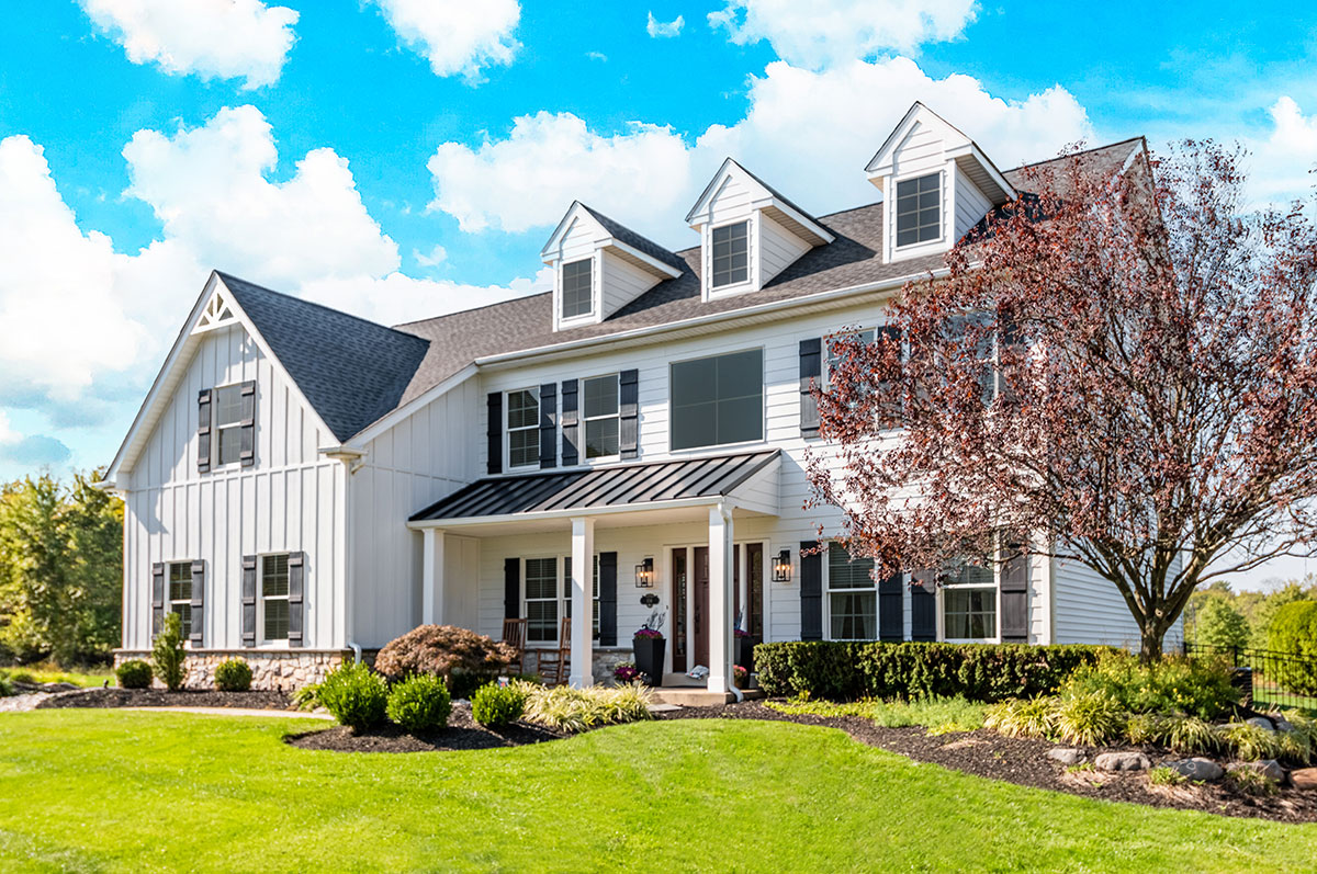 Modern farmhouse featuring white board-and-batten siding completed by expert Omaha siding contractors.